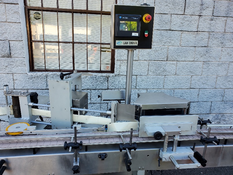 NJM UNI-300 VA Wrap around pressure sensitive labeler